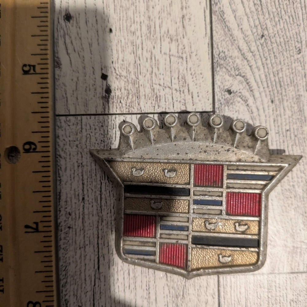 Cadillac Silver and Red Car Emblem